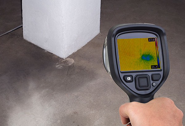 Chim Chimney Sweep Stock Image of Chimney Inspection Tool hand holding a digital inspection tool pointing at the floor as part of a chimney inspection
