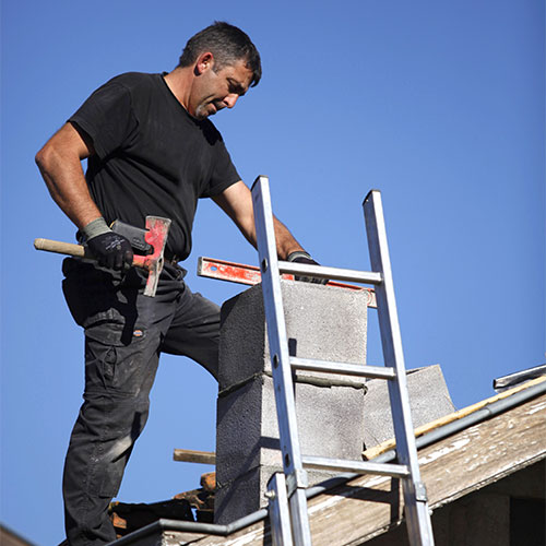 Chimney technician completing chimney repairs - Chimney Repairs