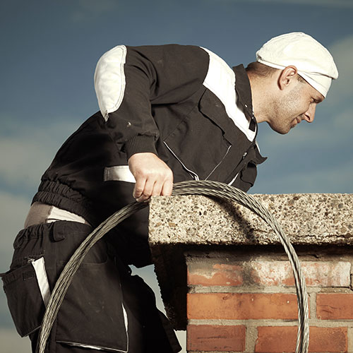 Chimney sweep performing service - Chimney Cleaning