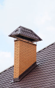 a modern masonry chimney with masonry looking cap