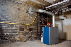 Reline Furnaces & Water Heaters - Middlesex County MA - Chim Chimney brick wall with furnace