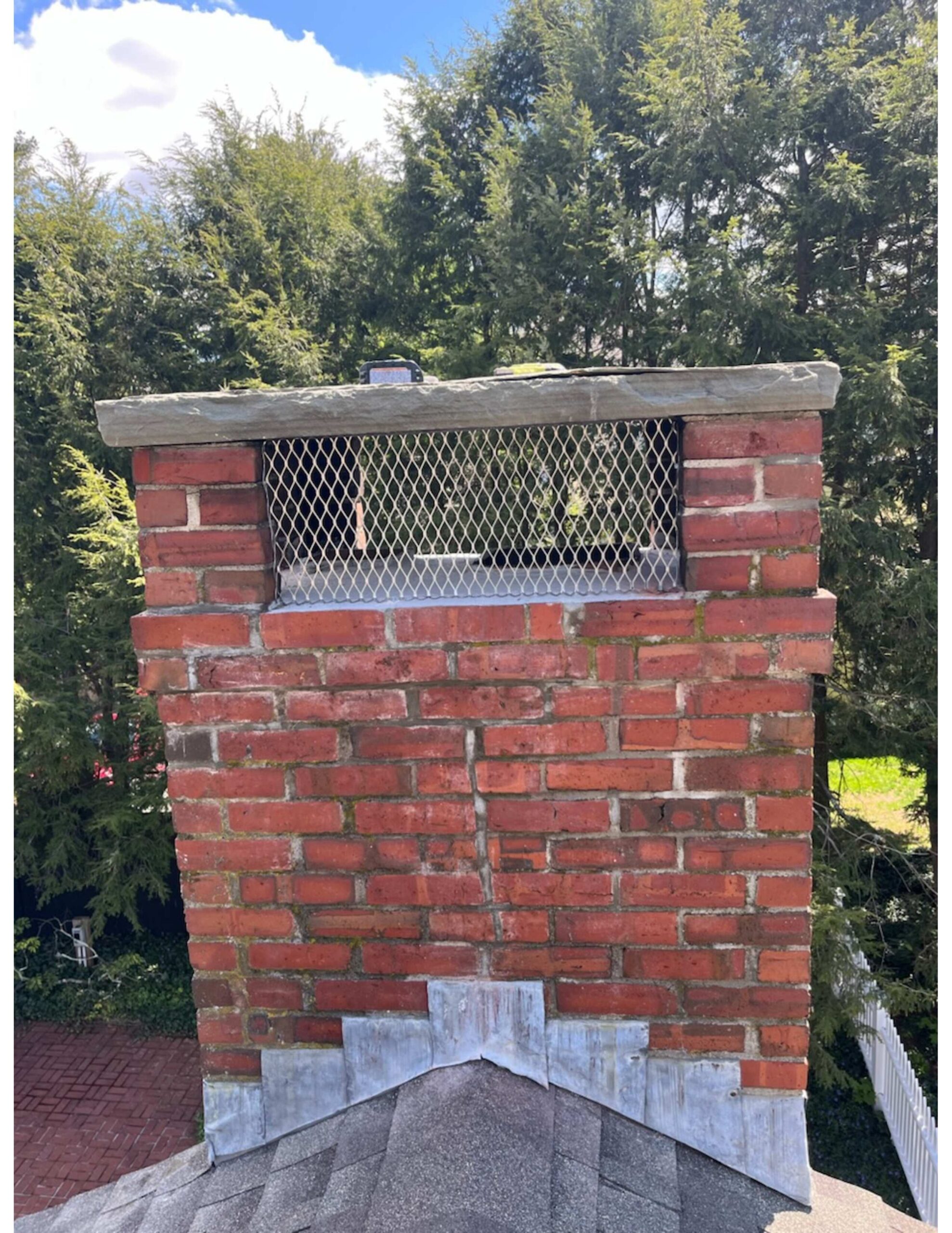 Original image of a custom chimney screen installed by Chim Chimney Sweep in Concord.